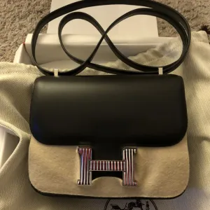 Hermès Constance Limited Edition 18 Noir (Black) Optique Veau Monsieur Enamel Hardware ENA